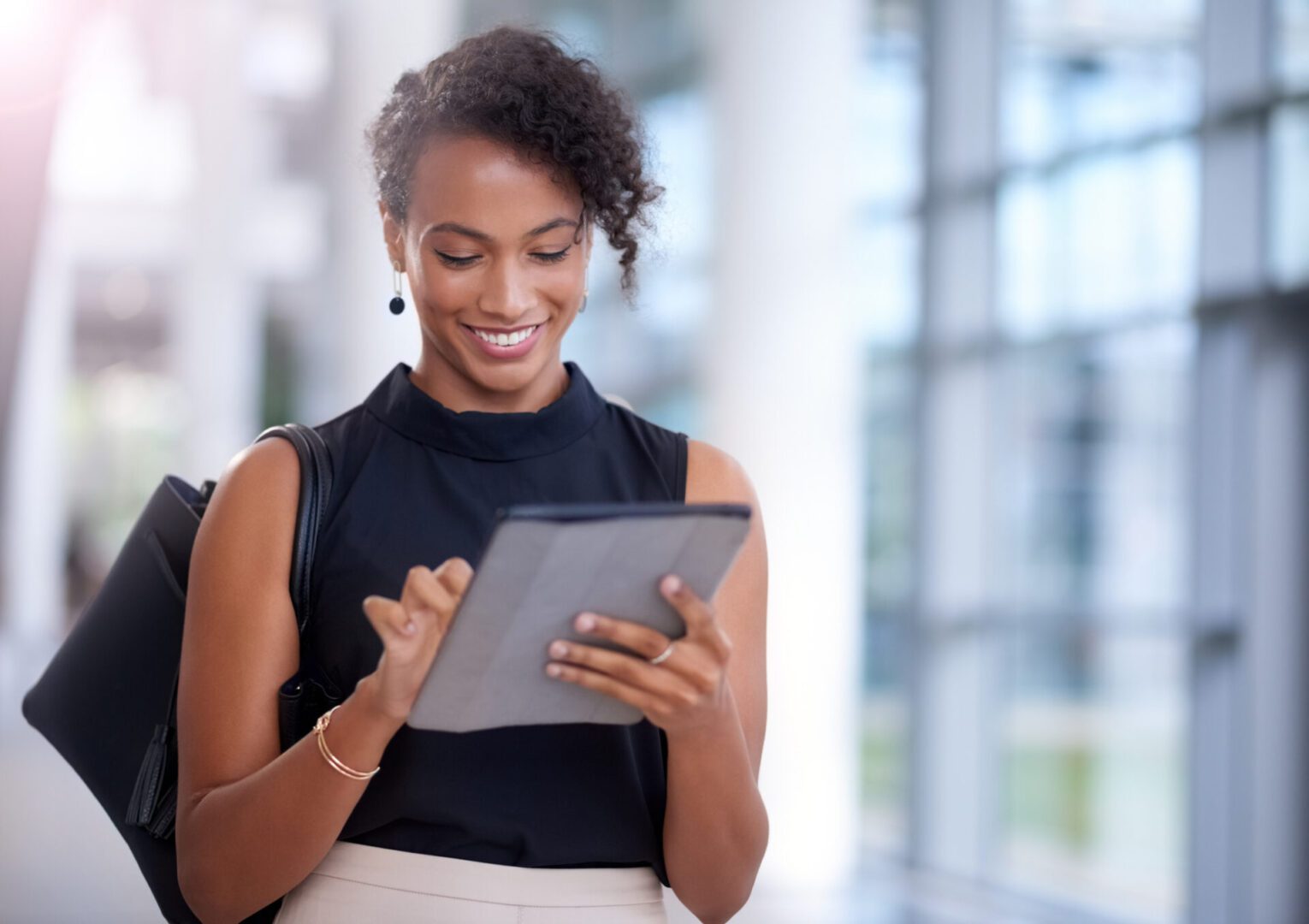 Shot of a young businesswoman using a digital tablet in a modern office